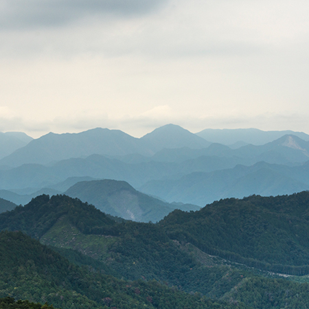 Layered mountain ranges fading into the distance in Japan